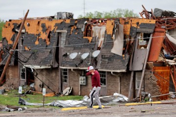 Baby among at least five killed after tornadoes rip through central US