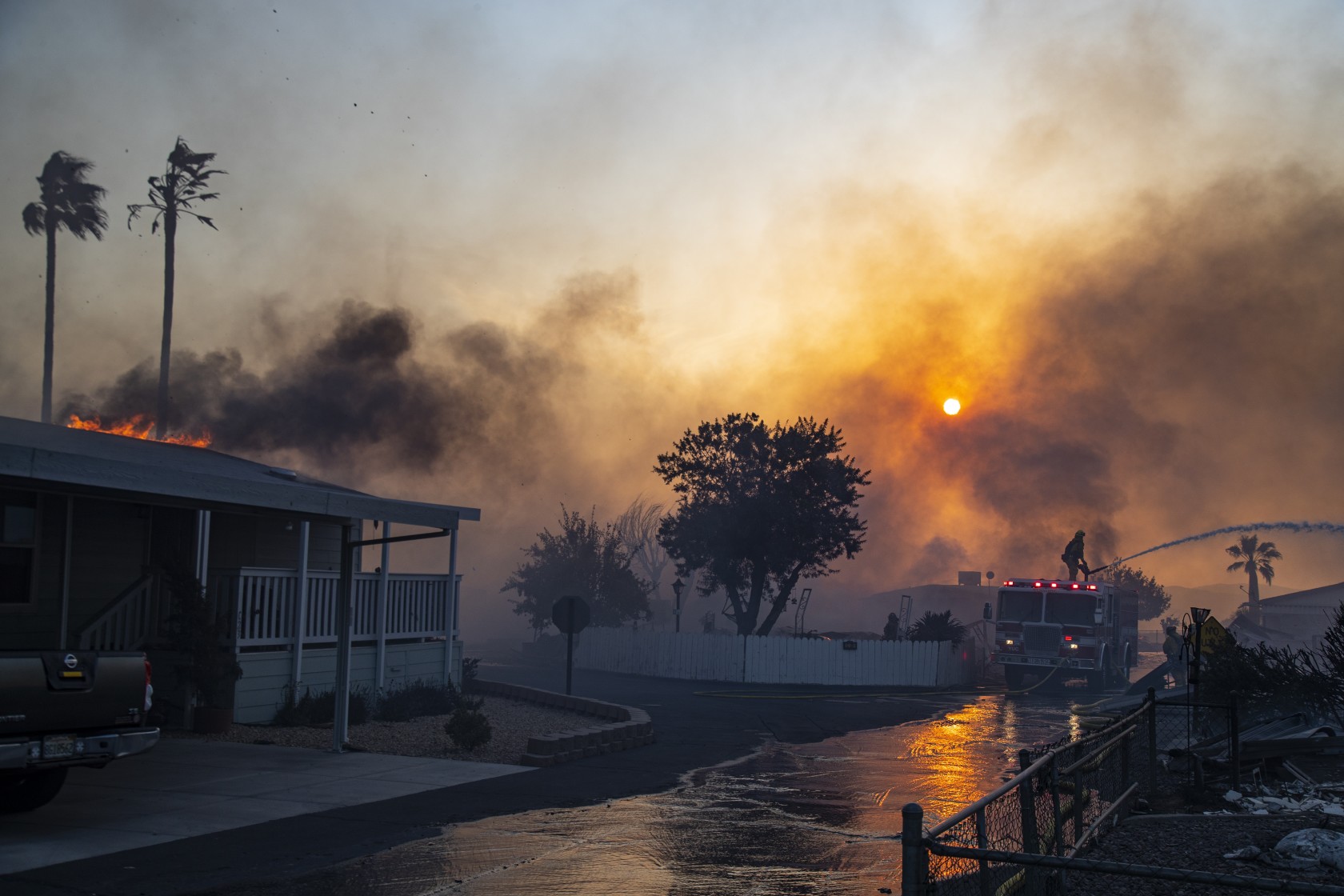 Fast-moving wildfire kills at least 1, destroys homes north of Los Angeles